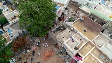 Aerial-view-of-a-tightly-packed-Indian-village-with-people