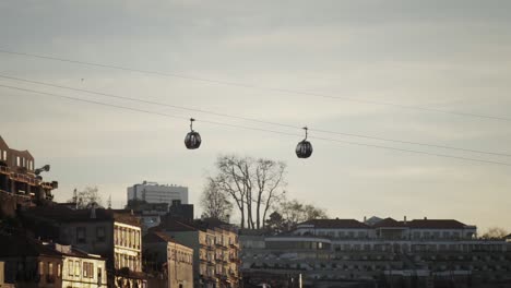 Two-cable-cars-moving-away-from-each-other-in-slow-motion-in-Porto