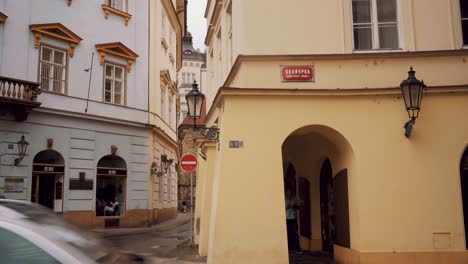 View-Looking-Down-Side-Of-Yellow-Building-In-Olomouc,-Czech-republic