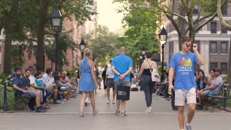 A-group-of-people-walking-through-Washington-Square-Park-in-New-York
