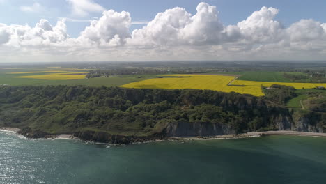 Panoramic-drone-view-of-Longues-sur-Mer-sea-cliff-on-sunny-day