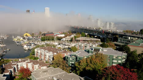 Aerial-rise-over-the-picturesque-Vancouver-waterfront-on-a-foggy-morning