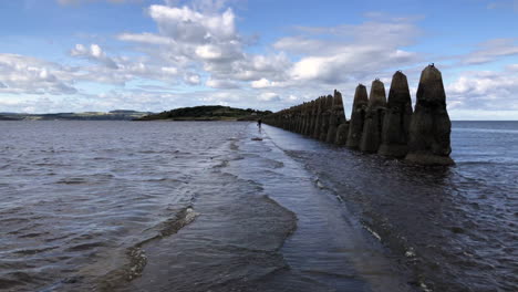 Tide-returning-to-Crammond-Island-and-covering-the-path-with-water,-Edinburgh,-Scotland