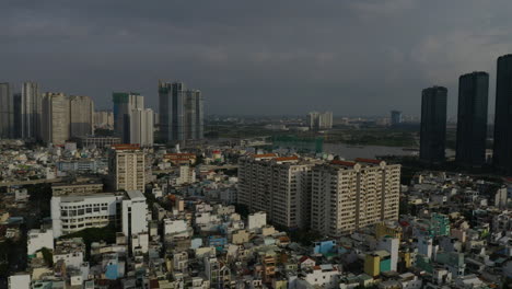 Afternoon-drone-footage-panning-across-Binh-Thanh-district-of-Ho-Chi-Minh-City,-Vietnam-featuring-pnorama-of-the-city-on-a-day-of-extreme-air-pollution-across-Southeast-Asia