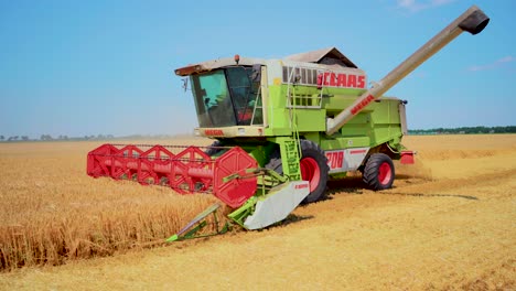 Combine-harvester-in-action-on-barley-field