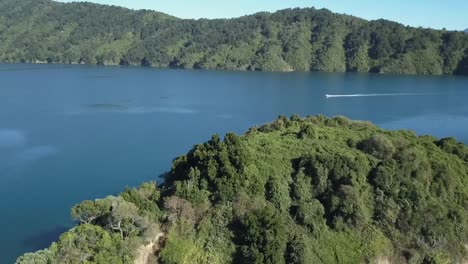 Drone-view-of-a-boat-in-Picton,-New-Zealand