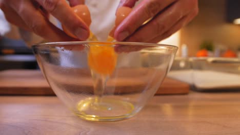 the-cook-pushes-the-egg-into-the-bowl