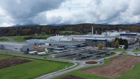 Aerial-panning-view-of-an-industrial-plant-in-rural-countryside,-IMPOL-aluminum-factory-in-Slovenska-Bistrica,-Slovenia