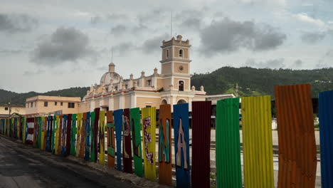 Time-Lapse-of-Clouds-and-City-Traffic-by-Catholic-Church-in-Center-of-Cayey-City,-Puerto-Rico