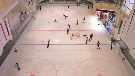 People-of-all-ages-are-seen-enjoying-and-learning-indoor-ice-skating-at-a-shopping-mall-in-Hong-Kong