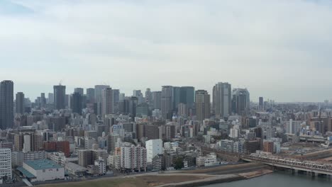 Osaka-Umeda-ward,-Aerial-pan-establishing-shot,-Japan