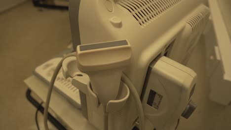 Close-view-of-expensive-ultrasound-linear-probe-and-machine-in-hospital-setting-for-diagnostic-imaging-procedures