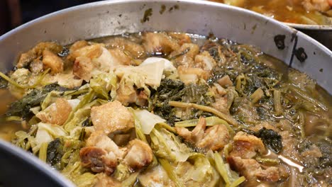 Close-Up-Footage-Of-Chinese-Vegetables-Soup,-Cabbage,-Spinach,-Lettuce-or-Seasonal-Vegetables-and-Pork-Belly-Boiled-For-Hours