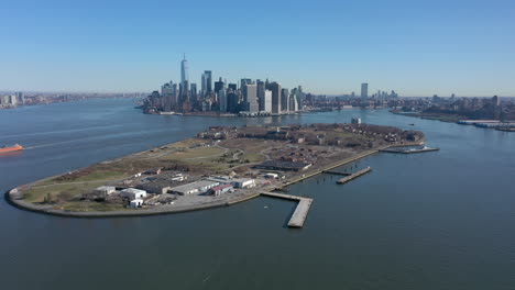 An-aerial-view-of-New-York-harbor-on-a-sunny-day-with-blue-skies-and-no-clouds