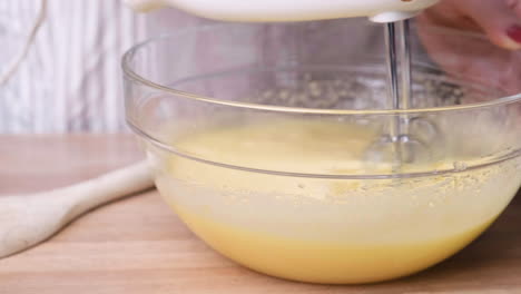 Mixing-Carrot-Cake-Ingredients-In-A-Bowl-With-An-Electric-Mixer