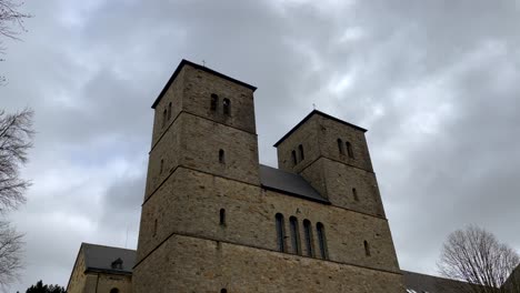 Bottom-view-of-Benedictine-abbey-monastery-named-Gerleve-during-cloudy-day