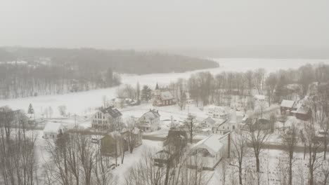 Wide-establishing-aerial-view-of-Monson-Town-in-Winter-whiteout