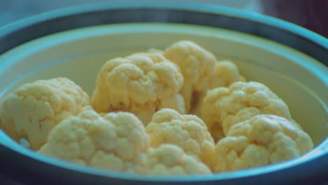 White-Cauliflowers-Cooking-in-Metal-Dish-Bowl,-Close-Up