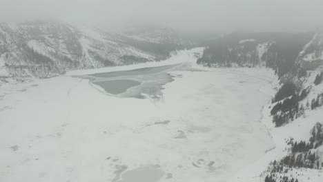 tilt-up-over-vast-frozen-lake-in-the-wilderness
