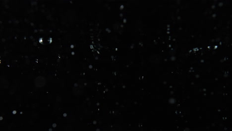 Bubbles-Rising-To-The-Surface-On-Black-Background