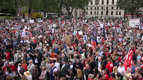 Thousands-of-people-gather-and-hold-various-placards-on-Parliament-Square-at-a-rally-in-support-of-Labour-Party-leader-Jeremy-Corbyn