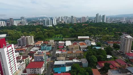 Aerial-drone-footage-of-modern-buildings-behind-the-park-in-Panama-City-with-camera-panning