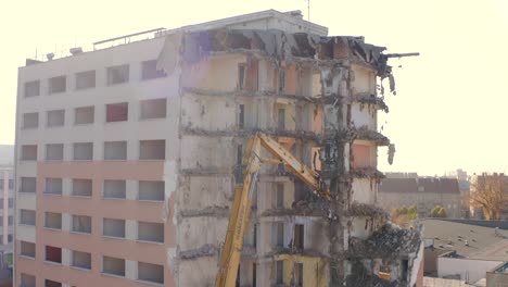 View-of-an-Excavator-with-a-long-boom-demolishing-a-high-rise-building