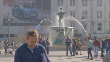 A-view-of-the-vibrant-and-colorful-city-square-Fountain-on-Rossio-Square,-Lisbon,-Portugal
