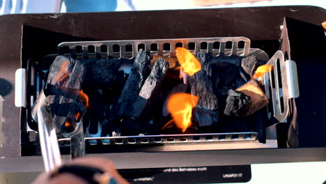 Replacing-charcoal-and-firestarters-in-the-grill-for-a-perfectly-set-barbecue