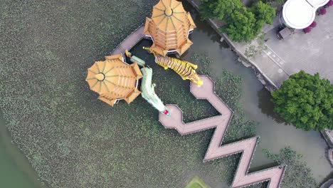 Topdown-Tabletop-Clockwise-Circular-Motion-Top-View-of-Spectacular-Dragon-And-Tiger-Pagodas-Temple-With-Seven-Story-Tiered-Tower-Located-at-Lotus-Lake-at-Kaohsiung-City-Taiwan