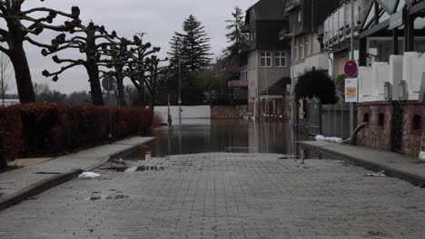 Kid-Walks-In-The-Flooded-Walkway-In-The-Town-Of-Walluf-In-Germany