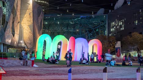 Wide-Shot-Time-Lapse-of-Sky-Castle-Inflatable-Interactive-LED-Light-rainbow-arches-by-ENESS-during-Christmas-2020-at-Federation-Square-Melbourne-Victoria-Australia