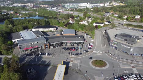 Bertel-O-Steen-Mercedes-car-dealer-Asane-Bergen---Aerial-view-of-company-building-with-logo---Summer-morning-with-traffic-outside