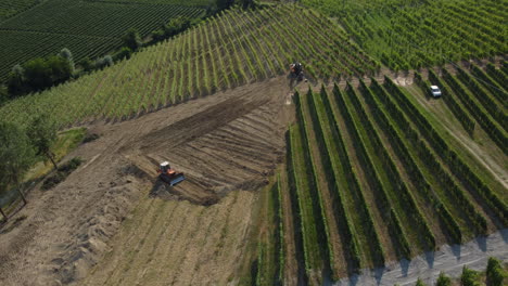 Tractor-machine-plow-ground-preparation-on-vineyards-agriculture-cultivation