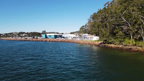 Fast-revealing-view-over-water-of-a-popular-scuba-diving-spot-the-pipeline-at-Nelson-Bay-Port-Stephens-NSW-Australia