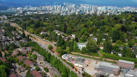 Aerial-View-Of-Arbutus-Ridge-Near-Shaughnessy-With-Distant-View-Of-Downtown-Vancouver,-Kitsilano-Beach,-And-Mountain-Range-In-Canada