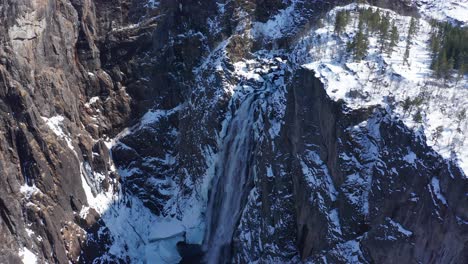 Frozen-Voringsfossen-and-spectacular-landscape-with-high-cliffs-and-deep-valley-during-wintertime-with-no-tourists---Aerial