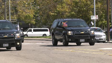 Presidential-motorcade-passing-by-on-street