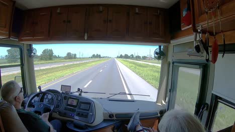 POV-of-man-driving-a-Class-A-recreational-vehicle-on-the-interstate