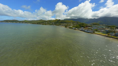 Sparkling-Shores,-FPV-Drone-Flying-Over-Glittery-Oahu-Shore-at-Kaneohe-Bay