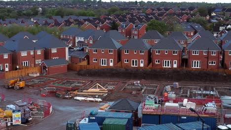 Construction-site-aerial-view-above-new-urban-real-estate-housing-development-regeneration-low-push-in