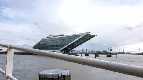 Hyperlapse-shot-of-modern-dockland-office-building-on-Elbe-River-in-Hamburg-during-dramatic-cloudscape-in-motion