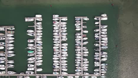 Boats-Lined-Up-At-Docking-Terminal-In-Howth-Harbour,-Dublin,-Ireland