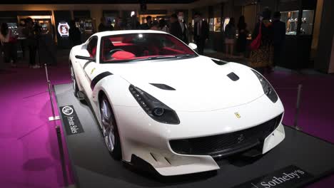 The-Italian-luxury-sport-car-brand-Ferrari-F12-TDF-special-edition-model-being-displayed-for-auction-at-the-world's-largest-brokers-modern-collectibles-Sotheby's-show-in-Hong-Kong