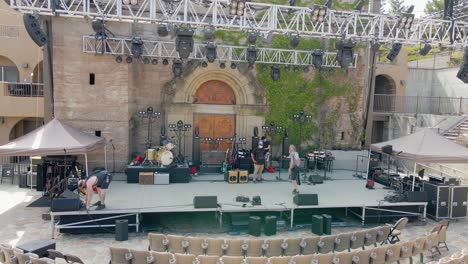 Aerial-drone-view-of-roadies-getting-the-stage-ready-for-a-concert-at-the-mountain-winery-in-Saratoga,-California