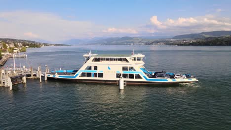 Drone-shot-of-ferry-Zürisee-loading-cars-onto-deck-in-Meilen-Switzerland