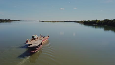 Small-empty-ferry-sails-across-the-Sao-Francisco-River-in-rural-Brazil