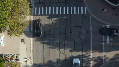 Aerial-top-down-drone-view-of-a-pedestrian-crossing-on-the-road