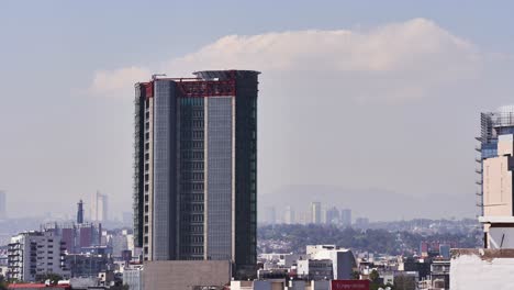 Mexico-City-skyscraper-building-timelapse,-day-still-shot-of-cityscape-horizon