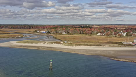 Wells-Maine-Aerial-v2-cinematic-pan-shot-capturing-drakes-island-beach,-harbor-marina-and-beautiful-natural-landscape-of-salt-marsh-and-estuary-during-autumn-season---October-2020